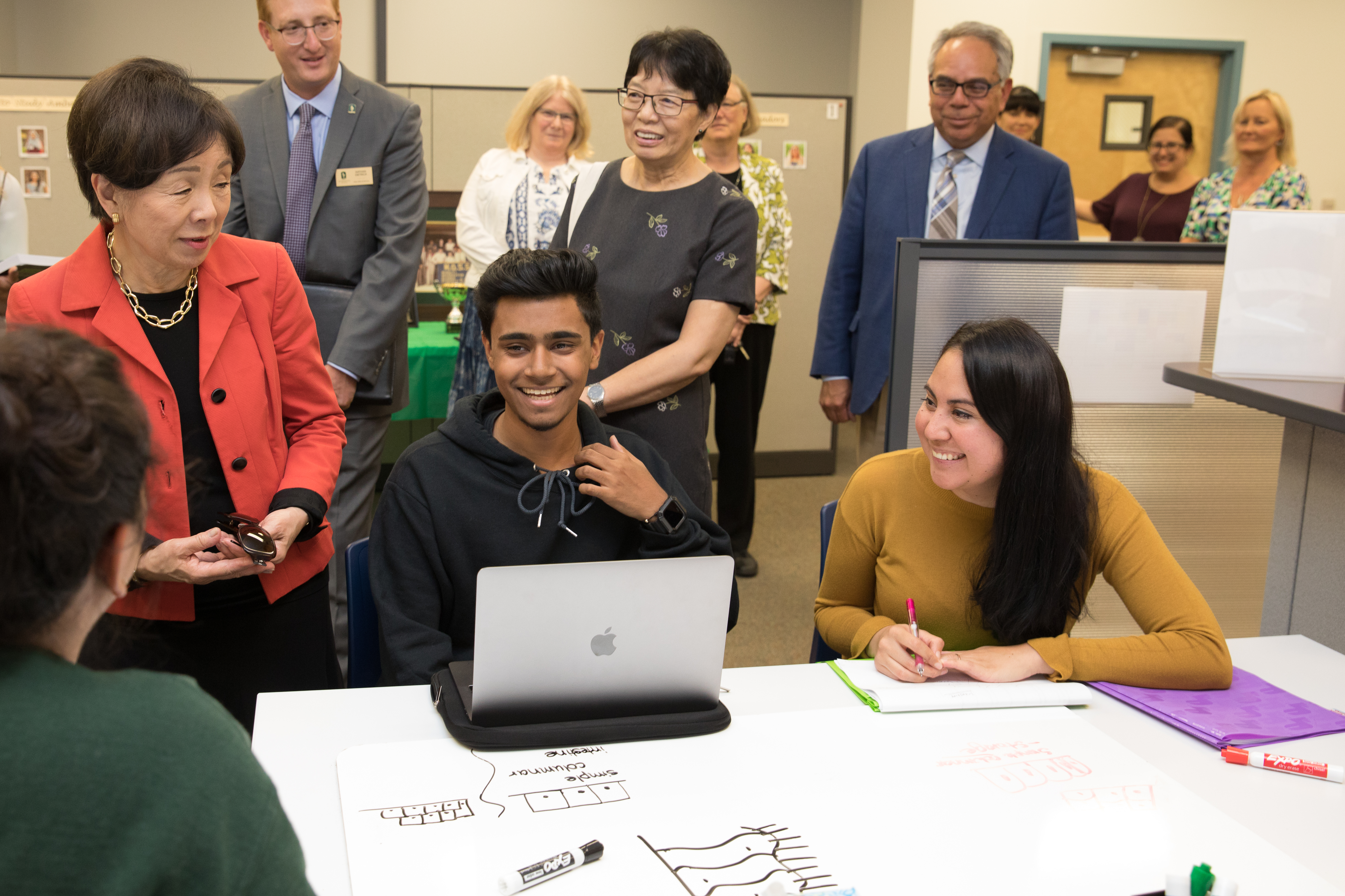 A photo of Congresswoman Doris Matsui talking with Sacramento State students