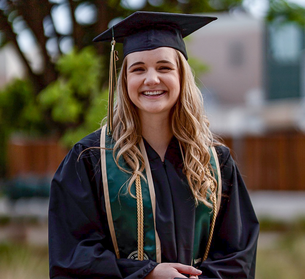 A photo of Madalyn Coughran in graduation regalia