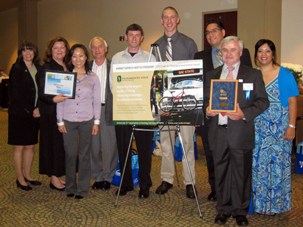 Abbi Stone and UTAPS Staff accept award