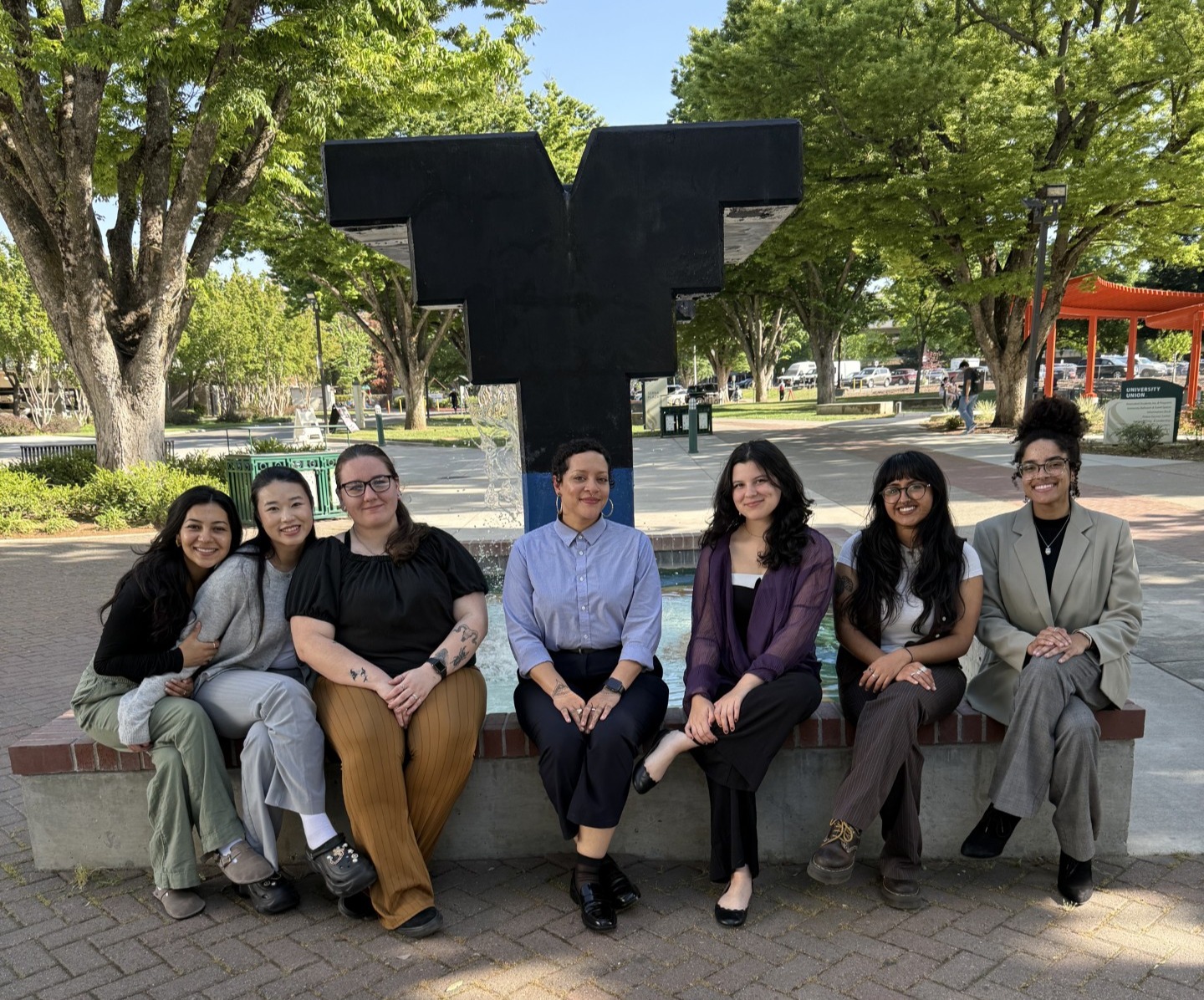 Scholars sitting at fountain