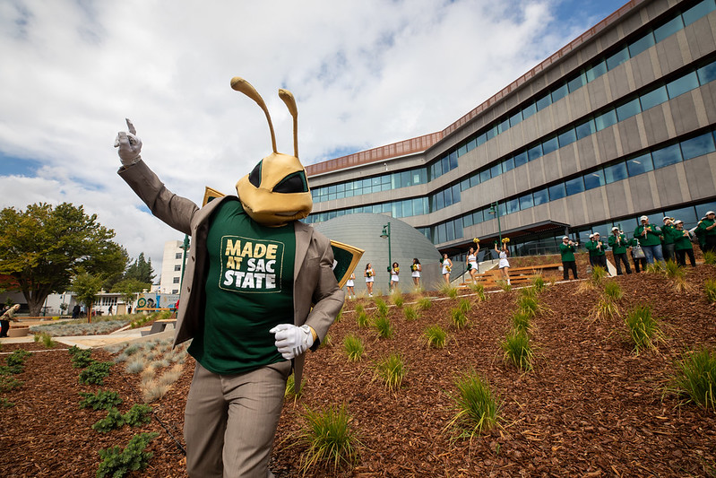 herky in front of Science Complex with Stingers Up