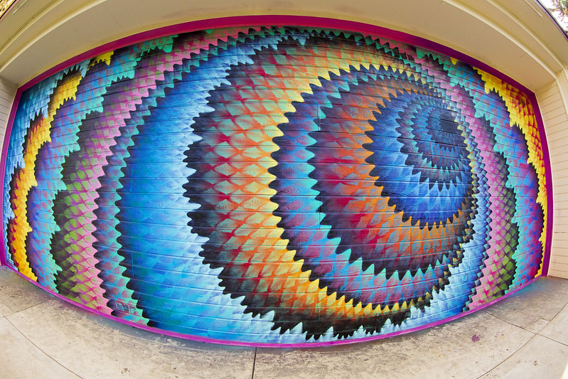 Mural on outdoor theater wall - vibrant colors in circles 