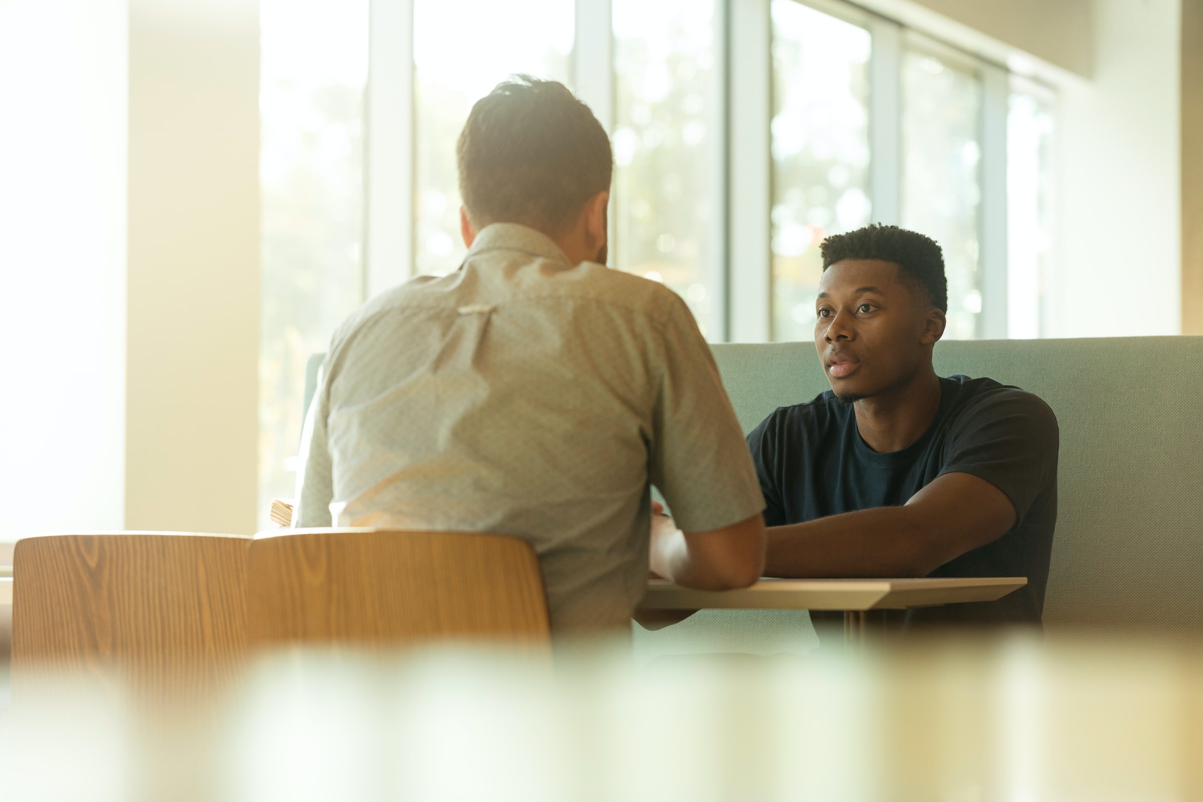 Young African American male meeting with a mentor