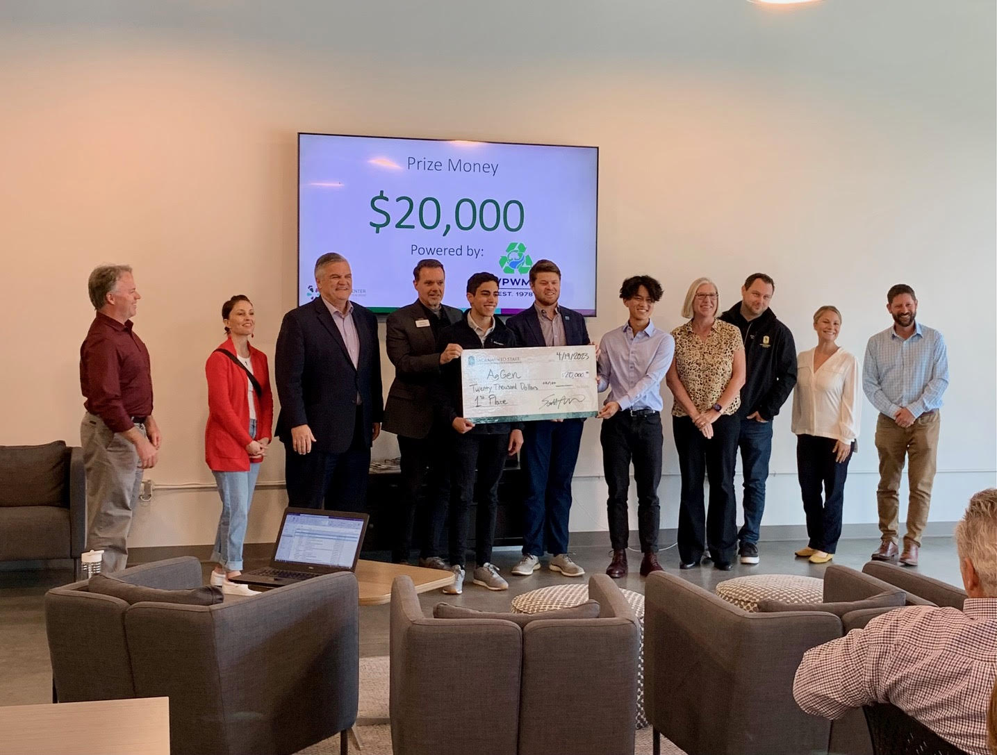 Photo of winners with big check