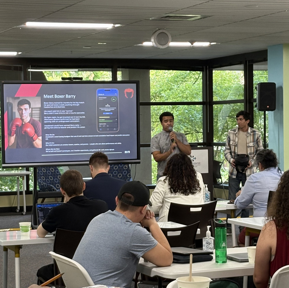 Ricky Bailey and Andrew Solbjor presenting HeadShotX