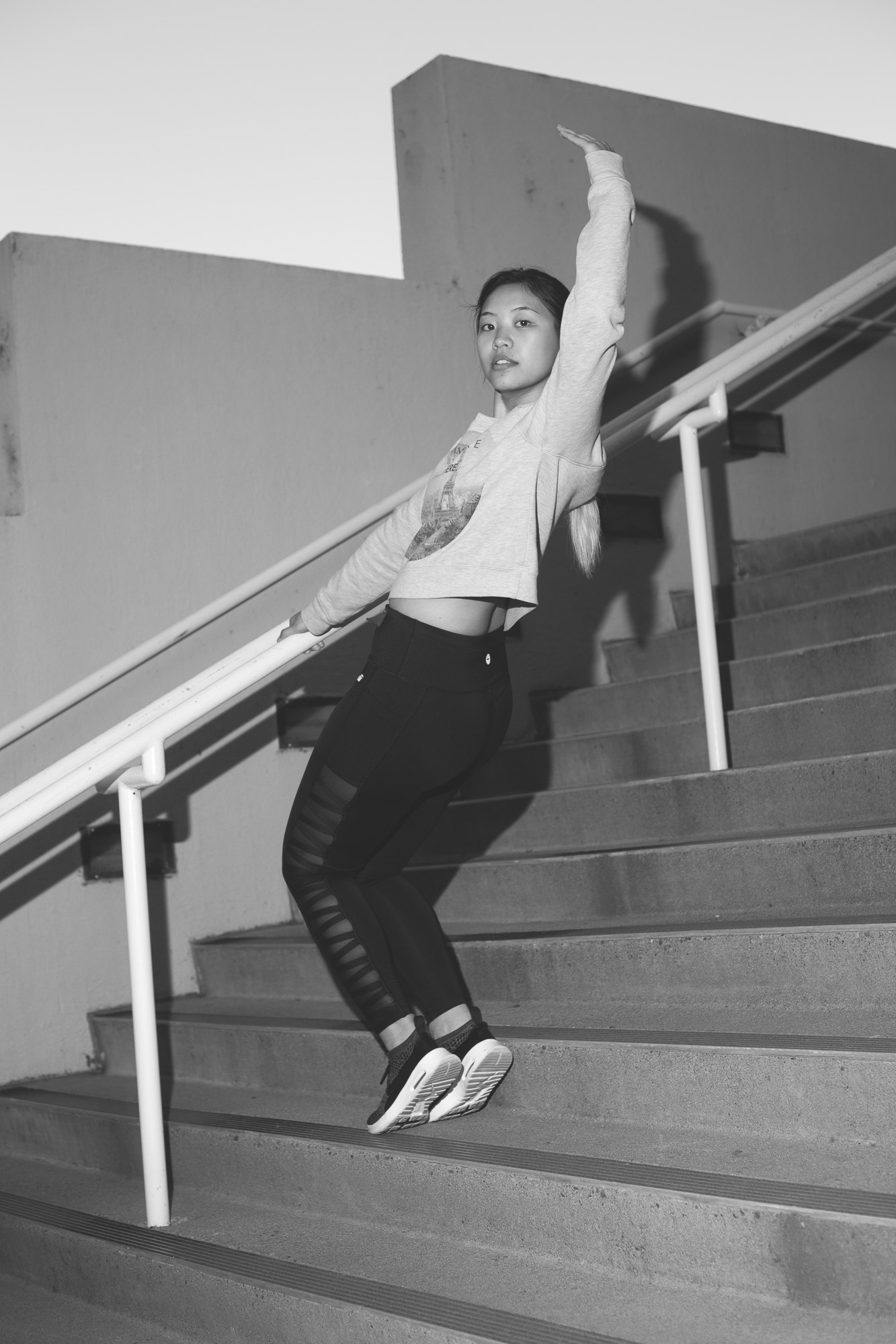 B&W photograph of dancer on steps made by student Mai Yang, '19