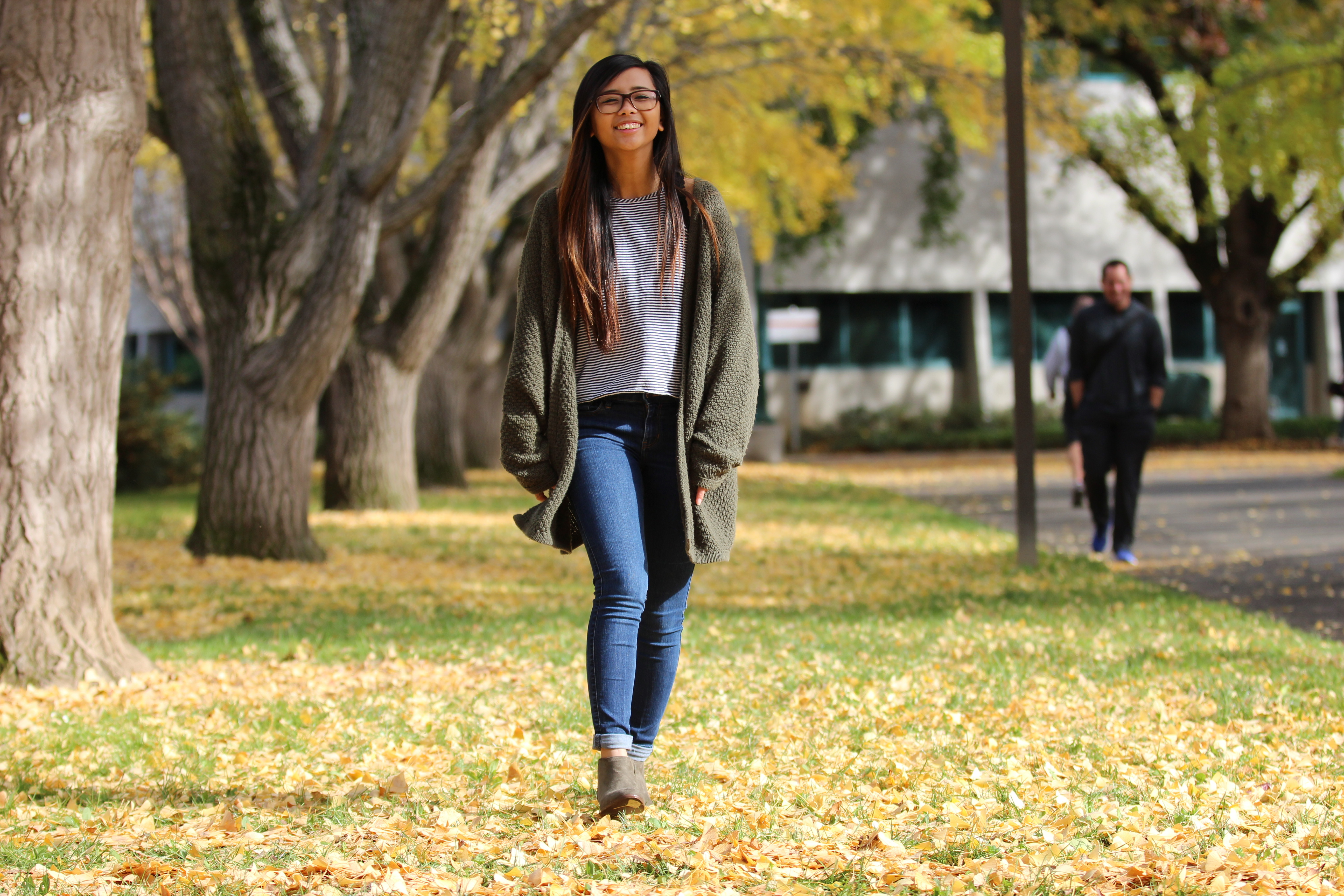 photo of student walking on campus