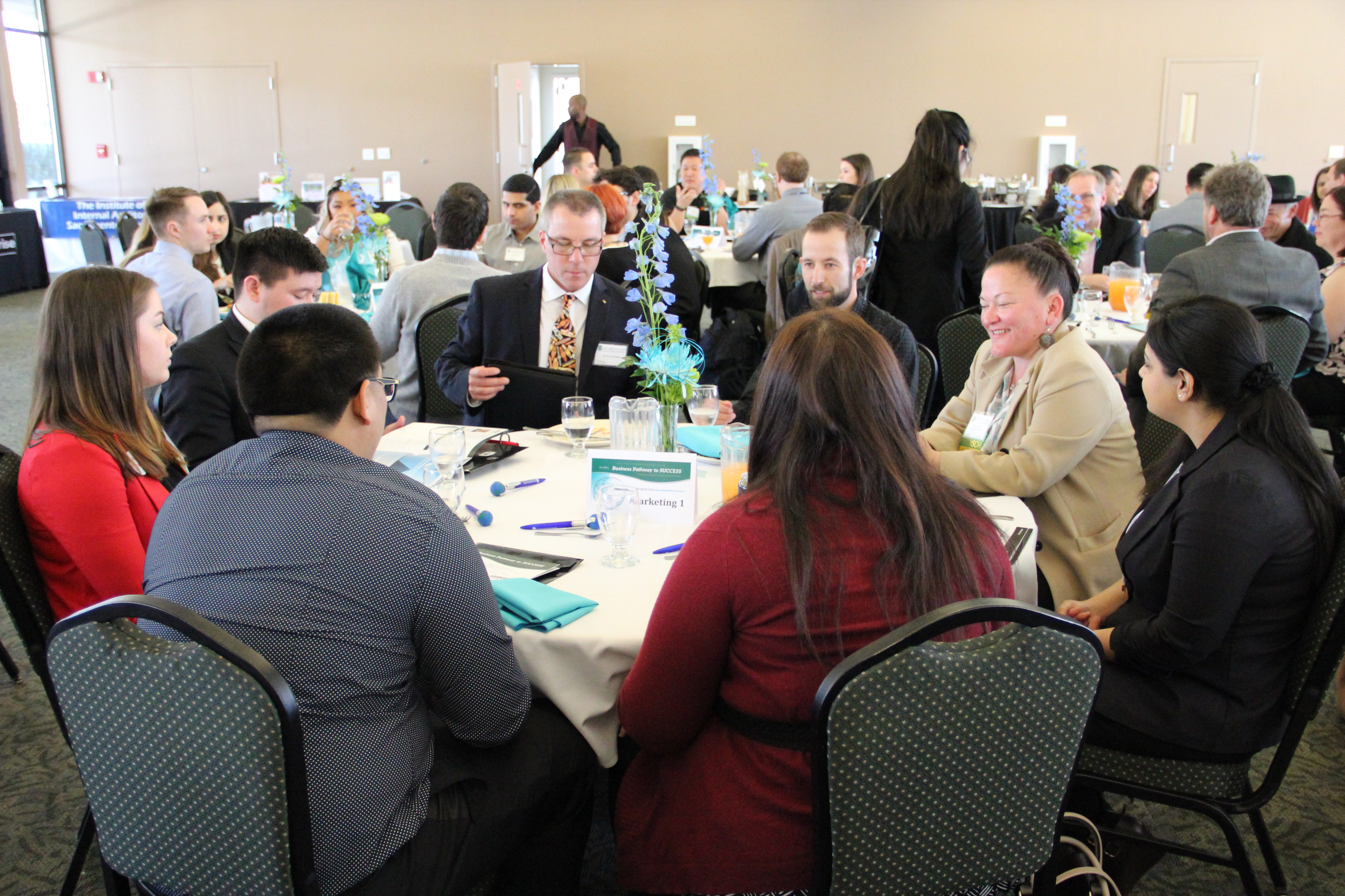 photo of students and employers seated at a table