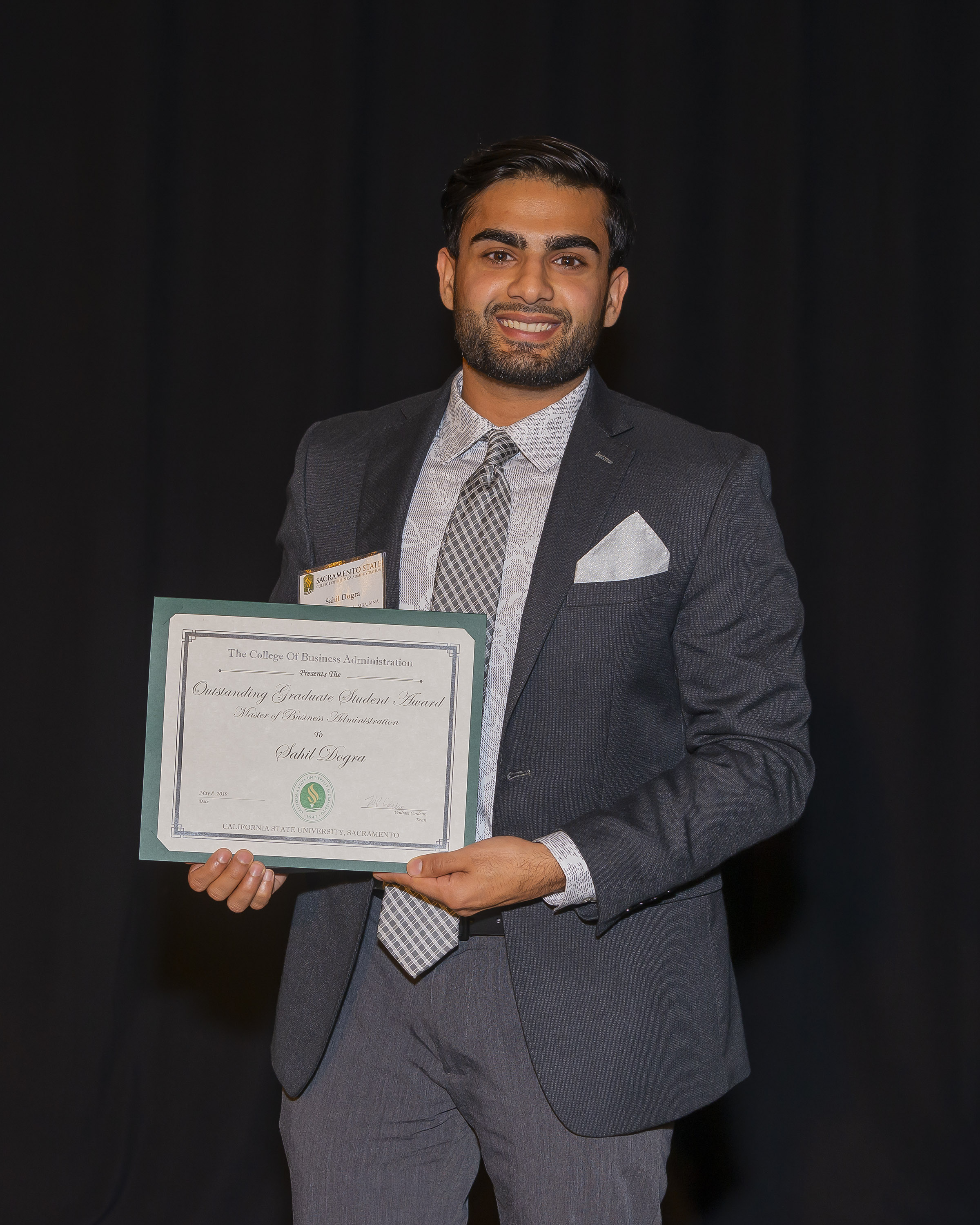 photo of a student award recipient holding a certificate