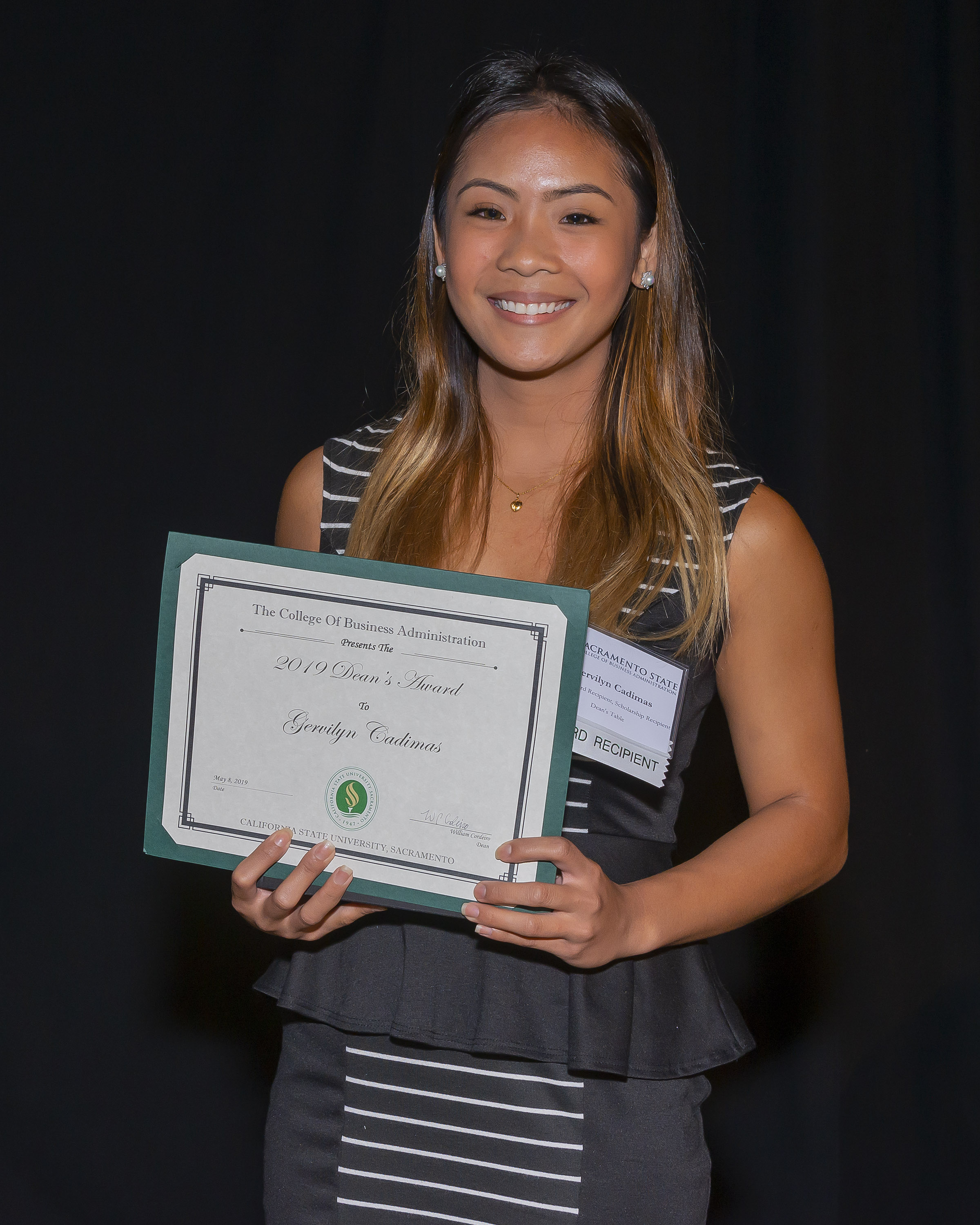 Photo of student holding a certificate