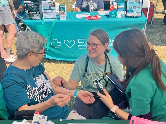 Health Hive event with patient and nurses