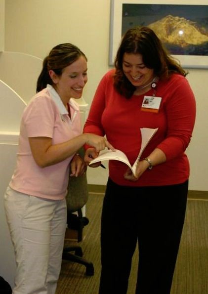 Clinical instructor reviews casework with a student