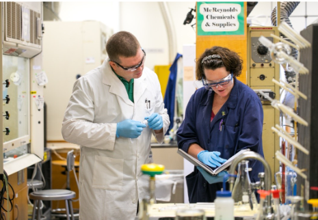 An image of two chemists in the lab