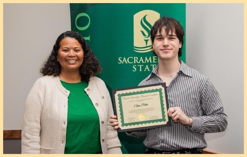 Ethan Potter shows off his award with Dr. Farmer