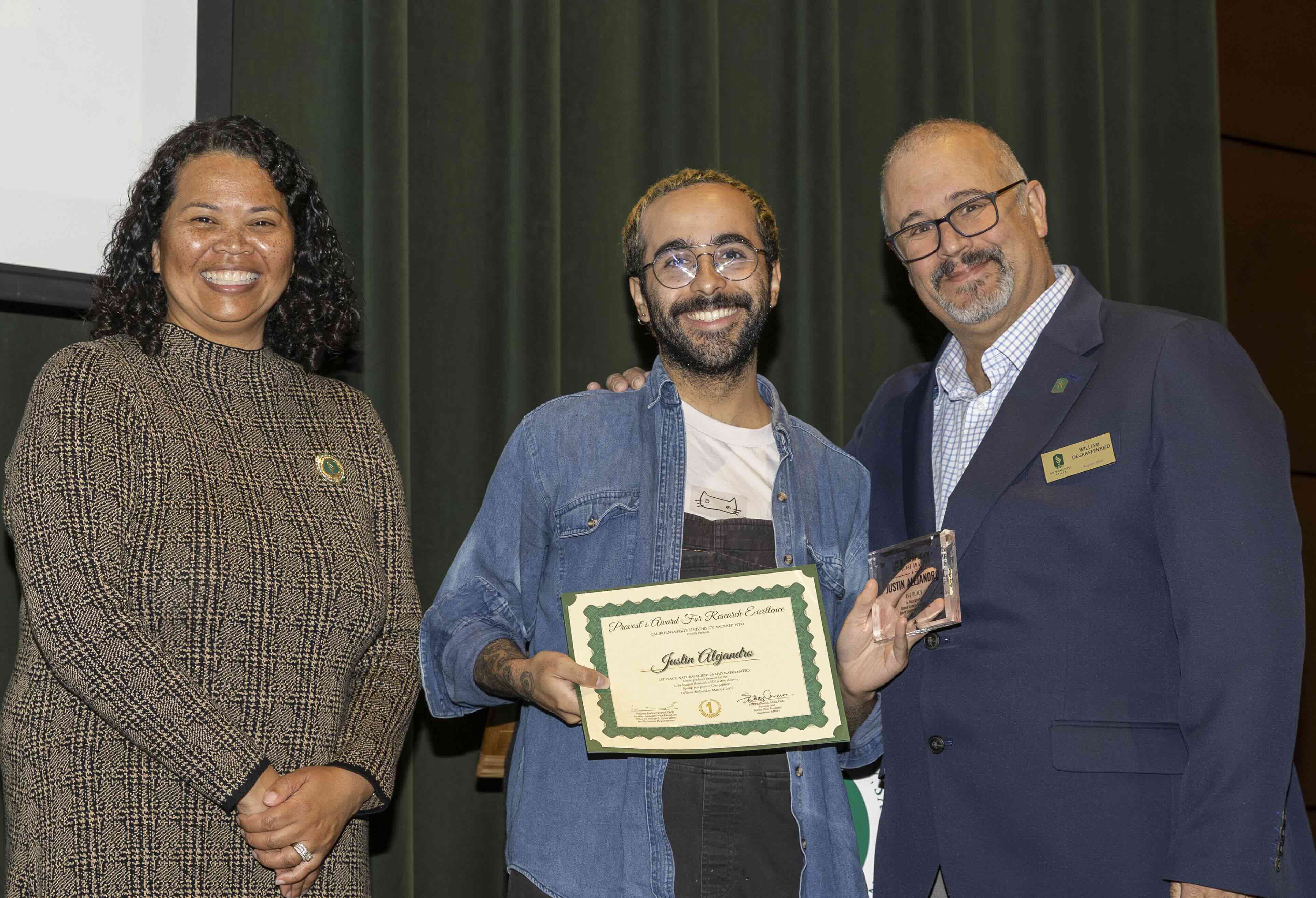 Ethan Potter shows off his award with Dr. Farmer