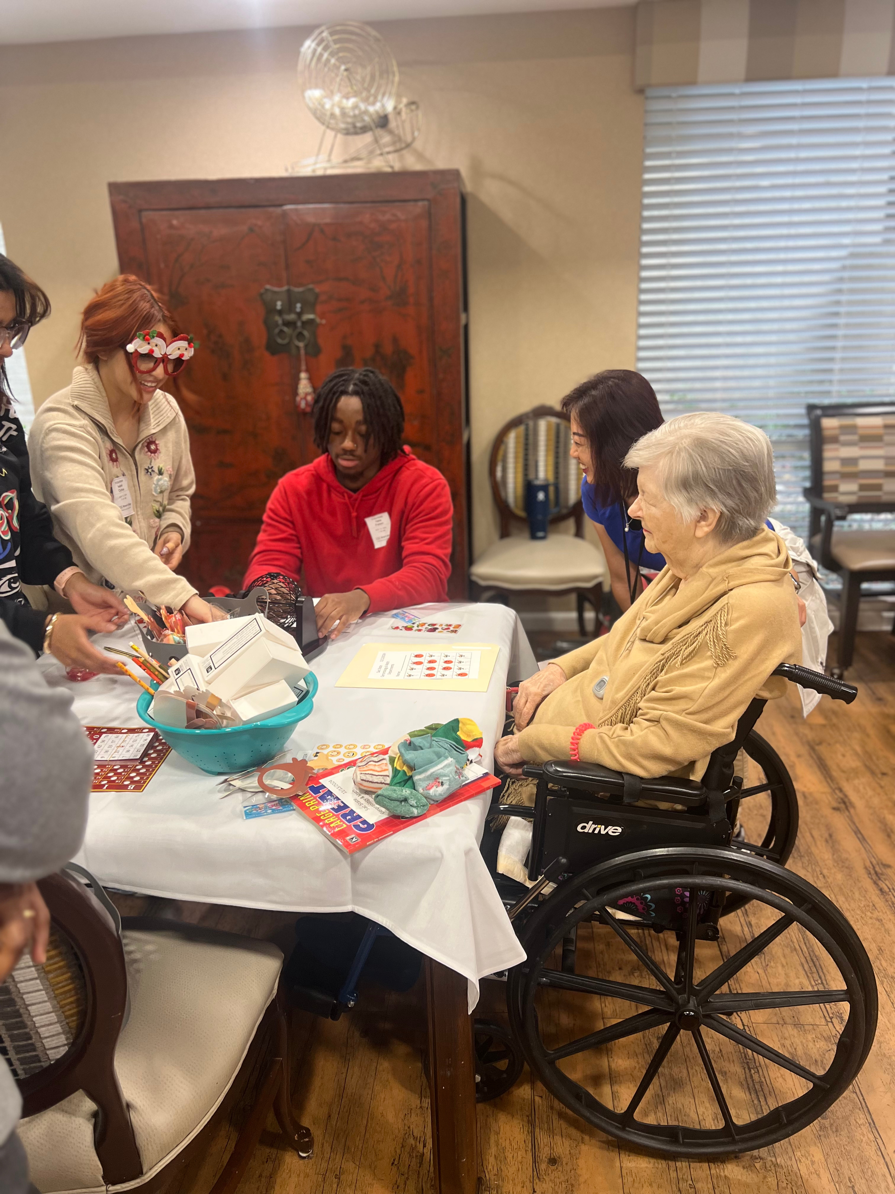 Students, with older adult and nurse.