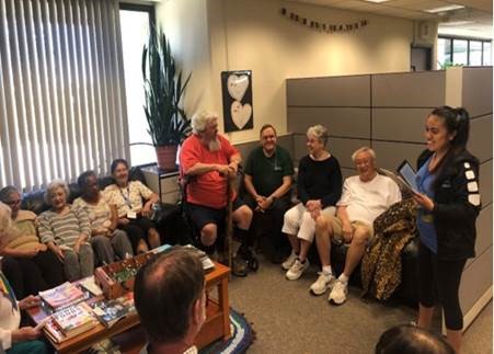 Student, Ines Torres, with older adults.