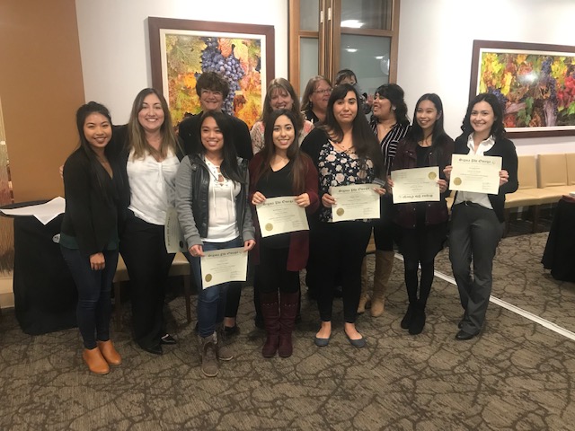 2019 SPO inductees lined up for photo with certificates.