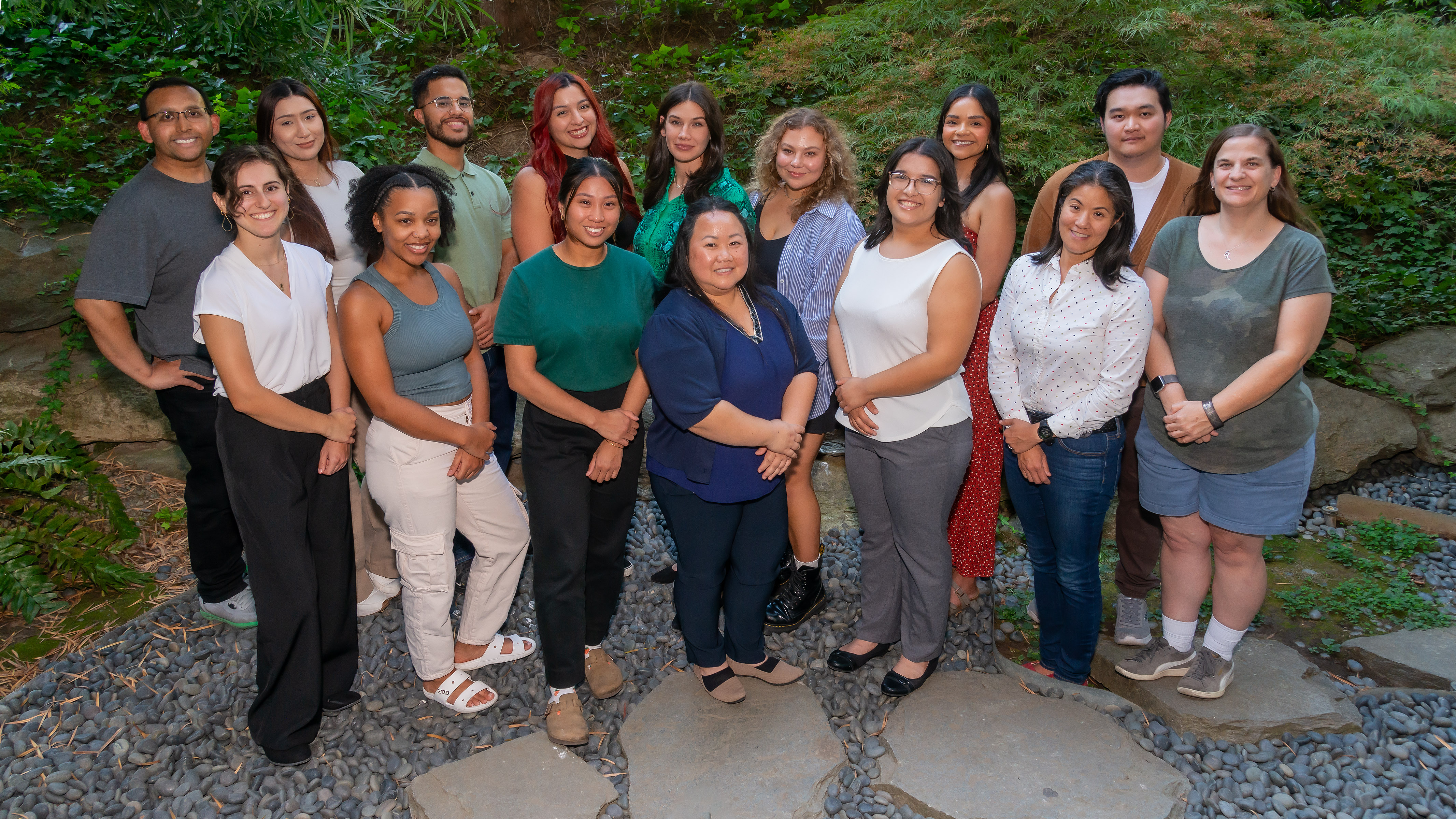 Group of diverse students standing in garden