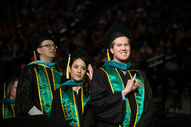 Commencement, 3 students in regalia