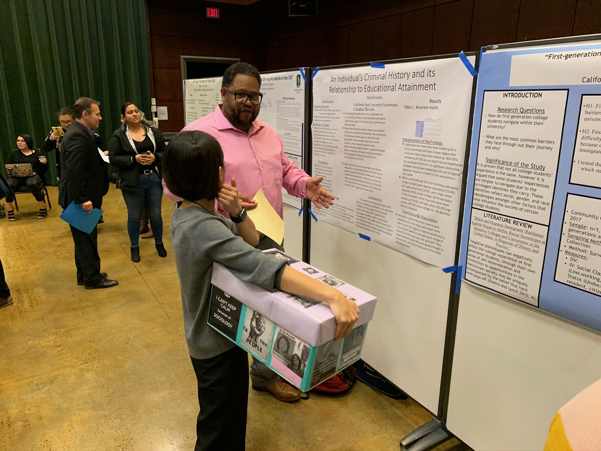 Harold Jordan presenting their research topic "An Individual's Criminal History and it's relationship To Educational Attainment" to Dr. Ida.