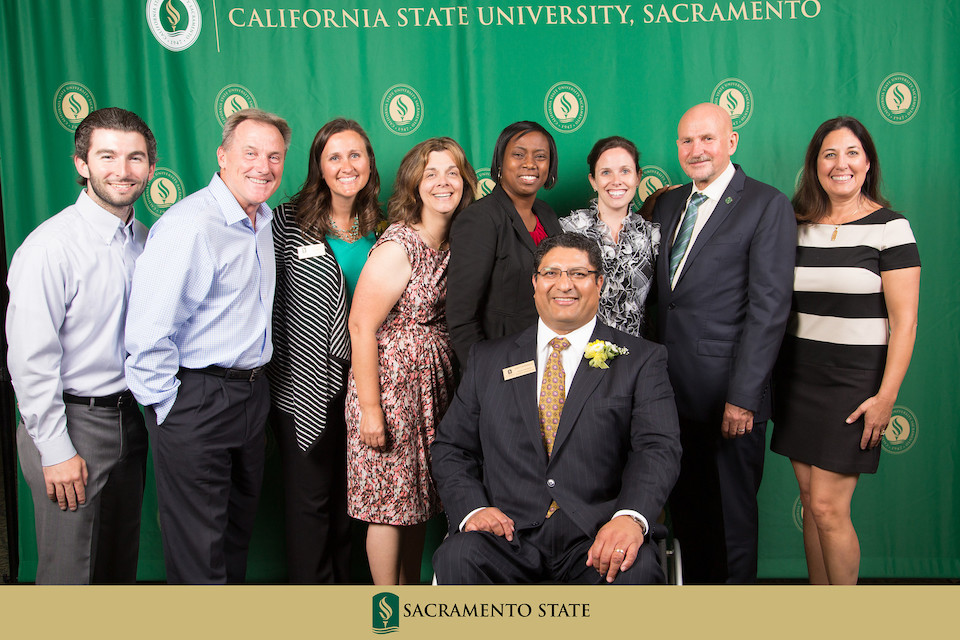 President Nelsen and committee members pose