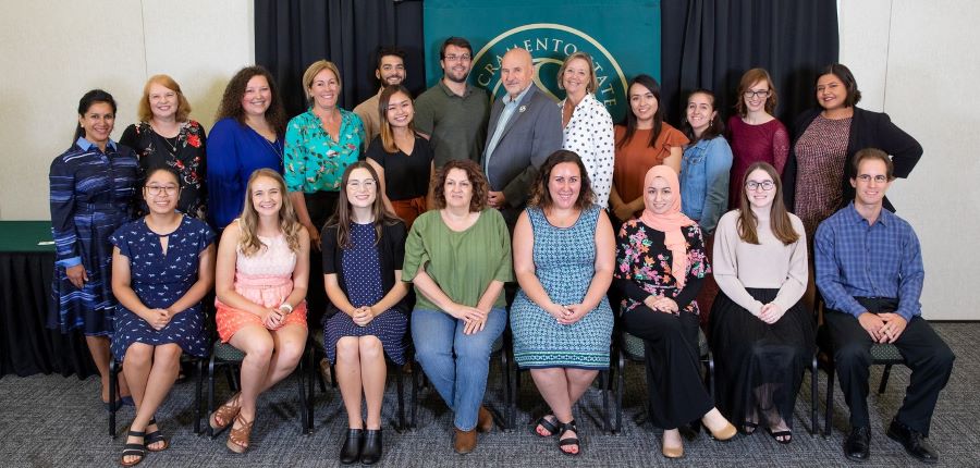 Group picture of scholarship recipients with President Nelsen