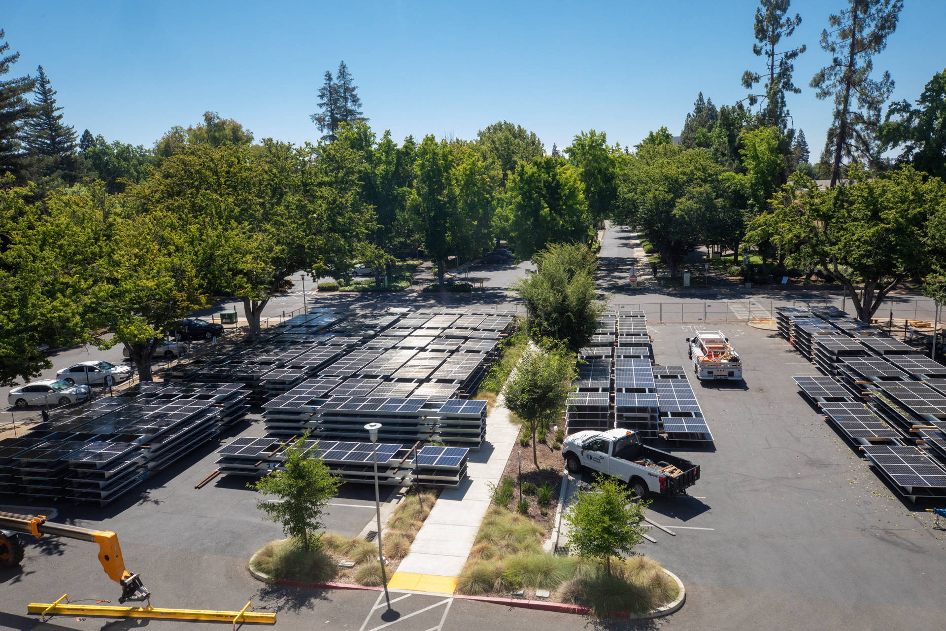 Solar Panels stacked in parking lot waiting for installation