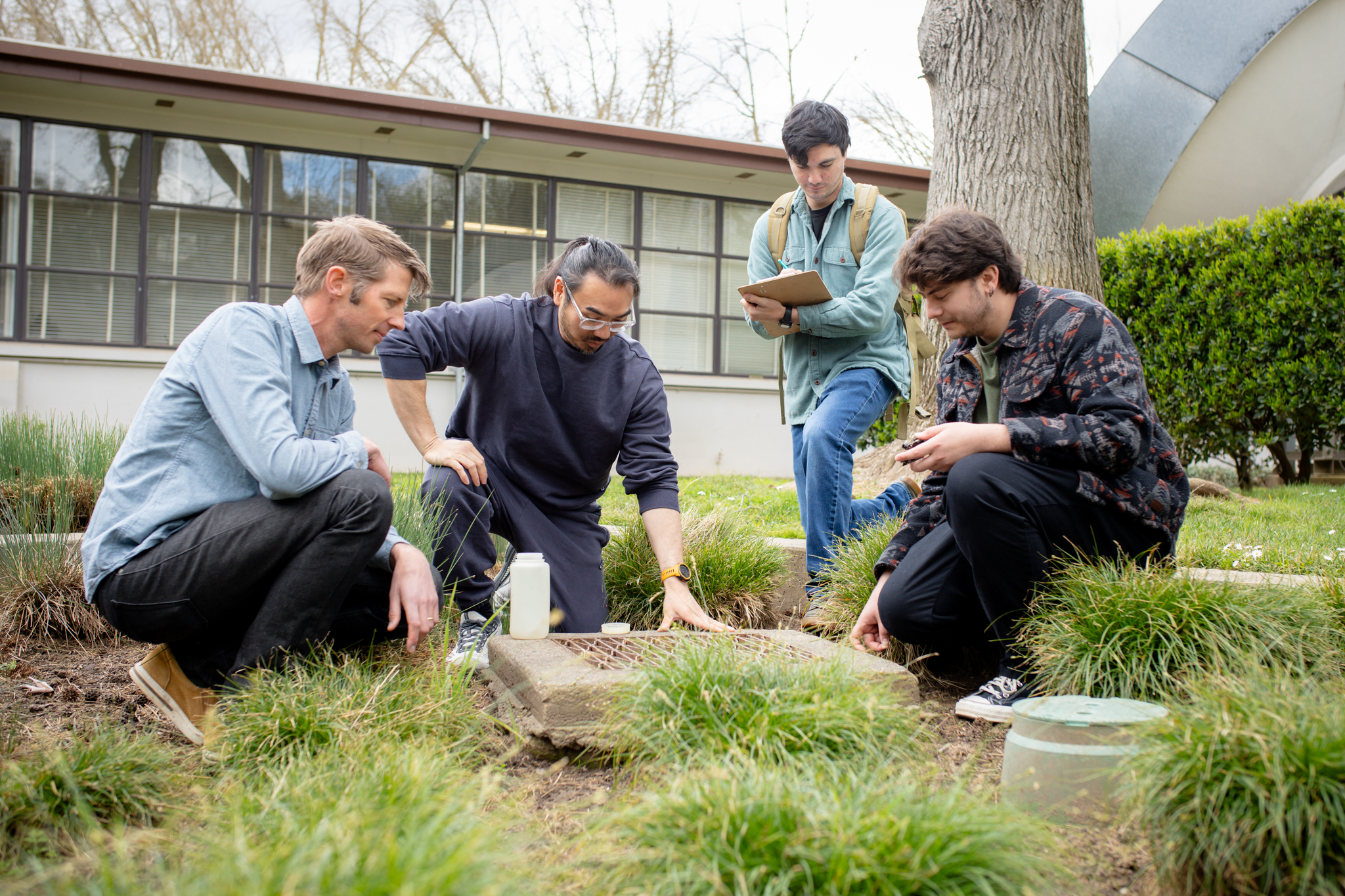 Julian Fulton, outside, with three Sac State students.