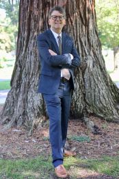 Image of Professor Rober Wassmer standing against a tree.