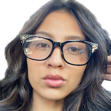 headshot of a young woman with large glasses