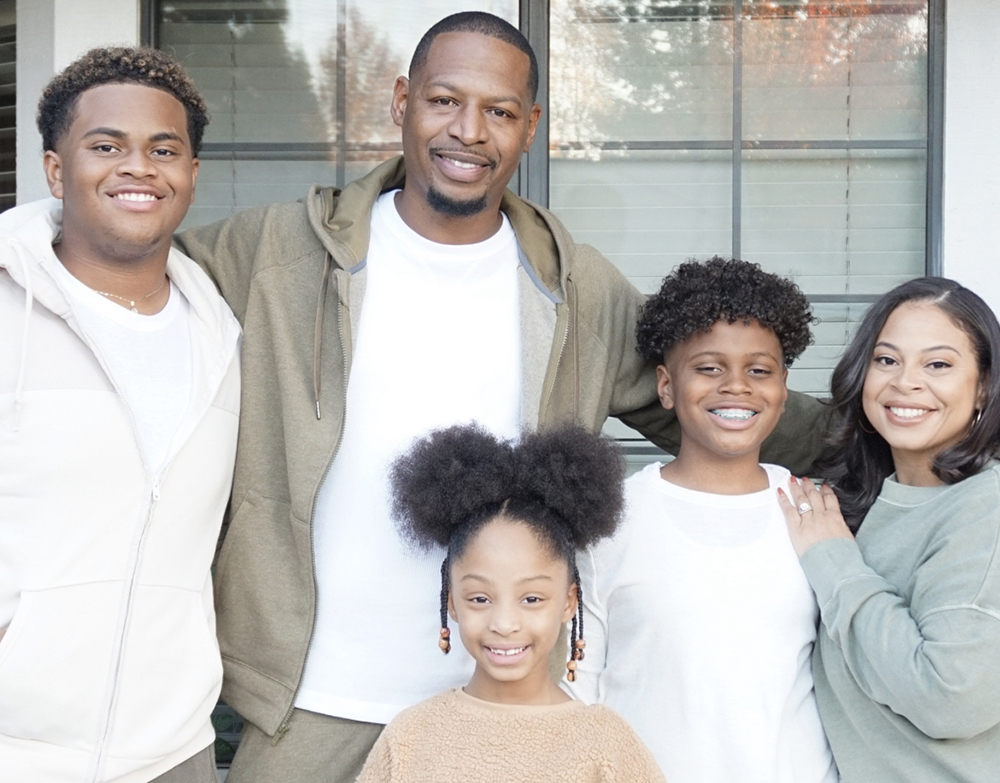 Woods with her husband and kids