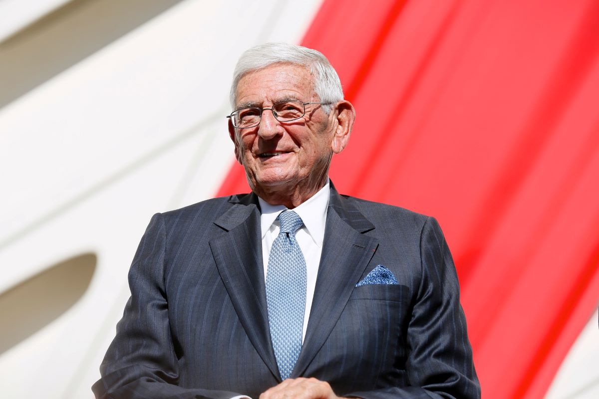 The late Eli Broad smiling in a blue suit