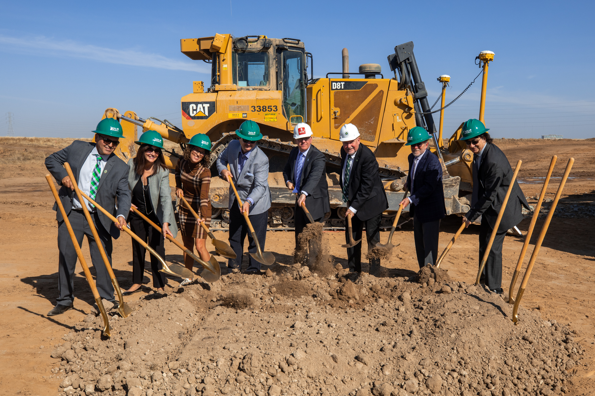 President Nelsen with other officials holding shovels at groundbreaking