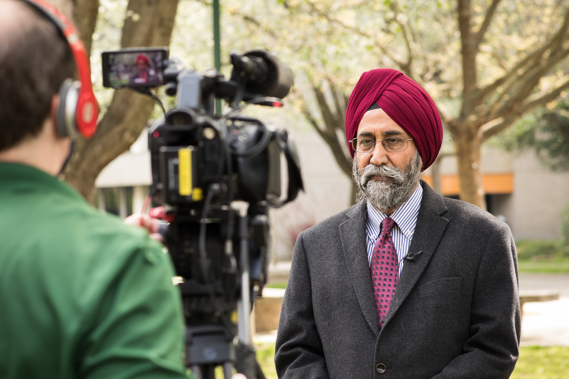 Professor Rekhi Singh being interviewed by the media