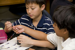 Picture of scout(s) doing physics experaments. Select (click) picture to view it enlarged.