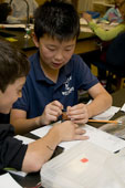 Picture of scout(s) doing physics experaments. Select (click) picture to view it enlarged.
