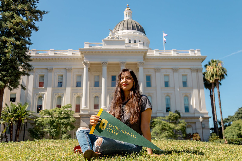 Image of state capitol with student