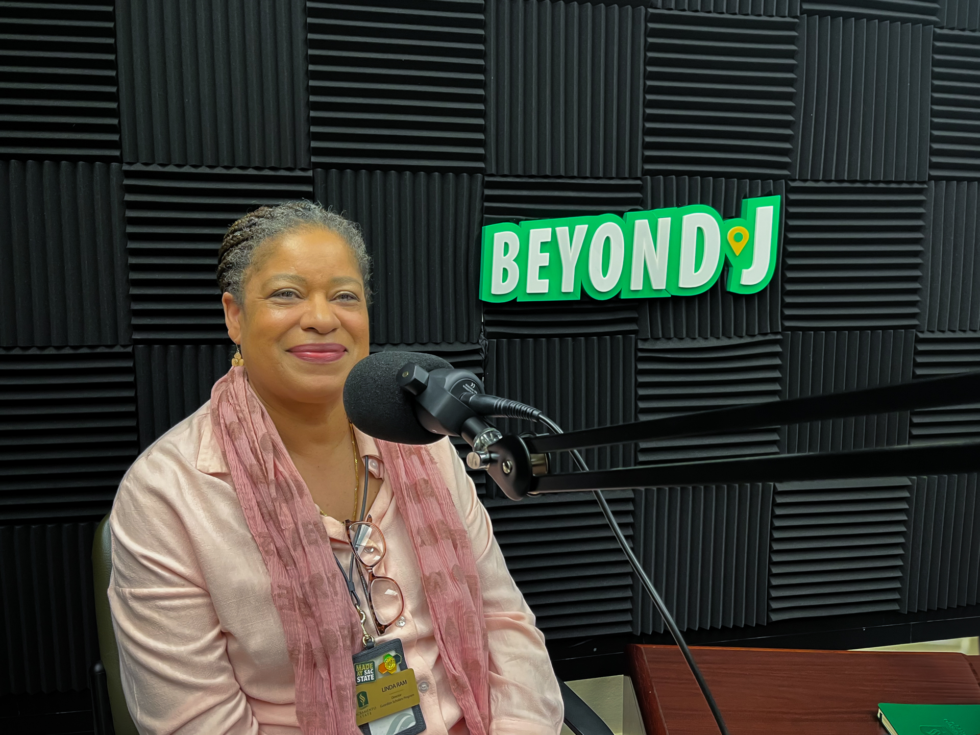Linda Ram, speaking inside the Guardian Scholars Program office