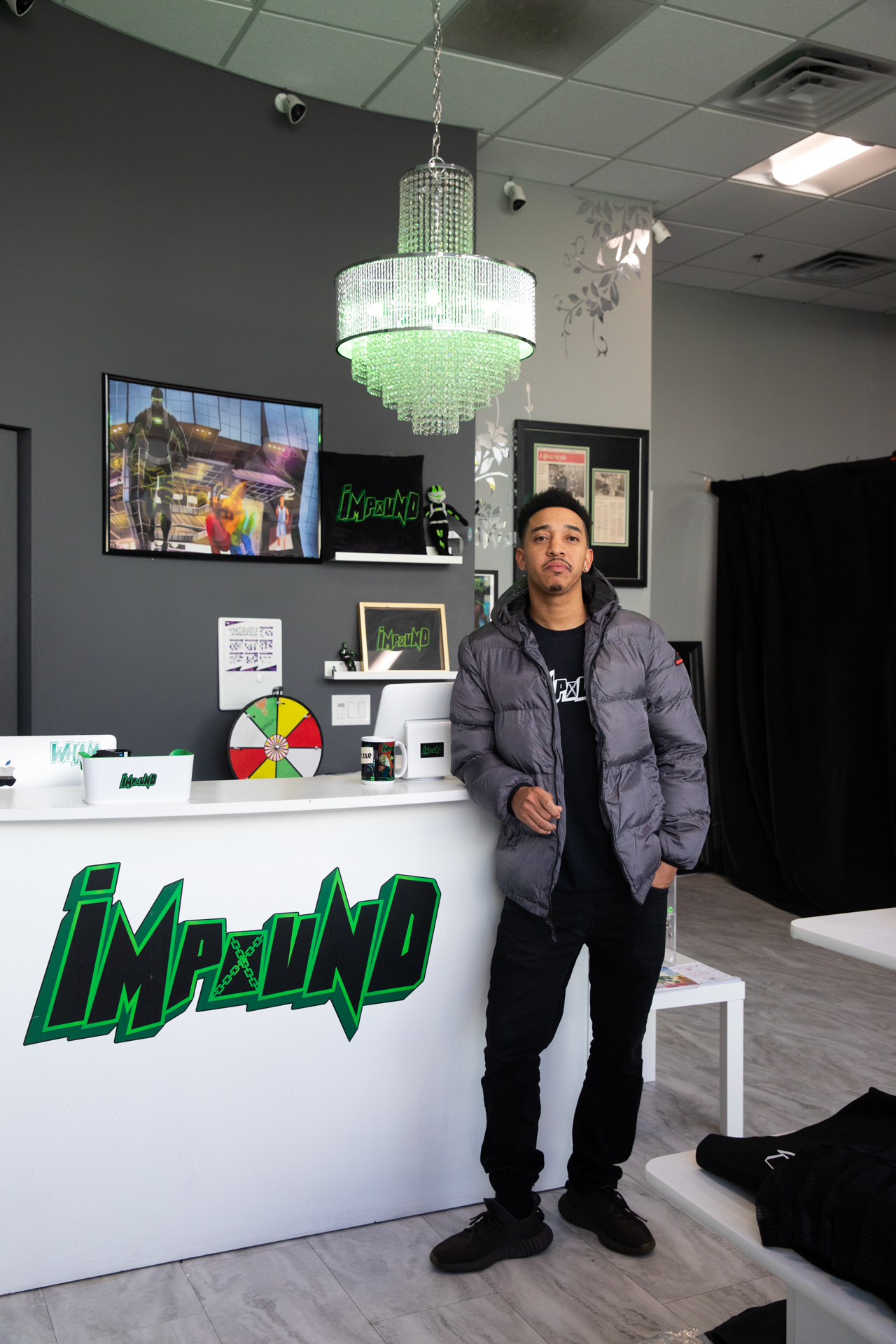 Brent Trayce Sands leans against the front counter of his downtown Sacramento comic book store.