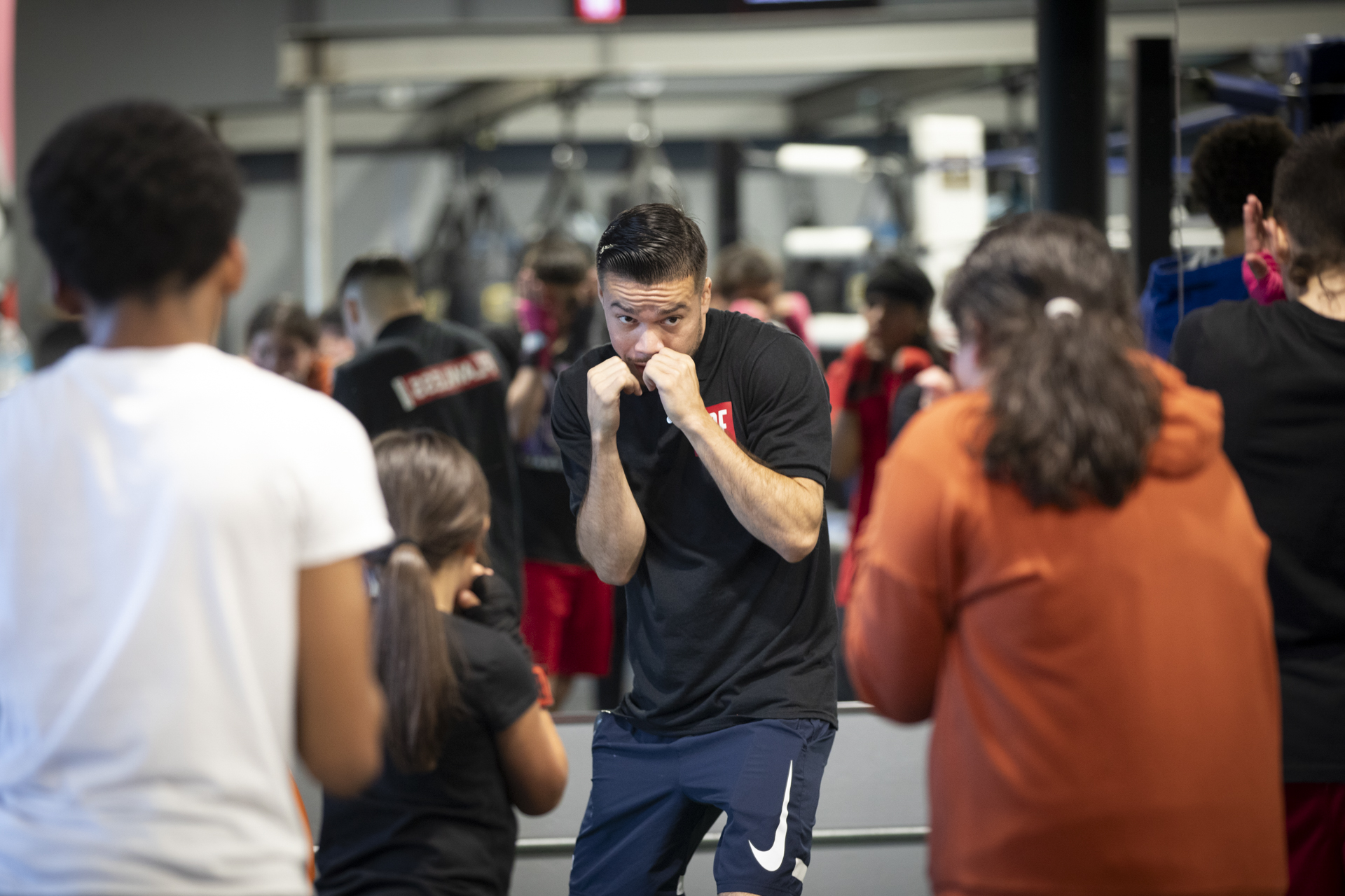 Alumnus Kevin Montaño works out with the next generation of boxers.