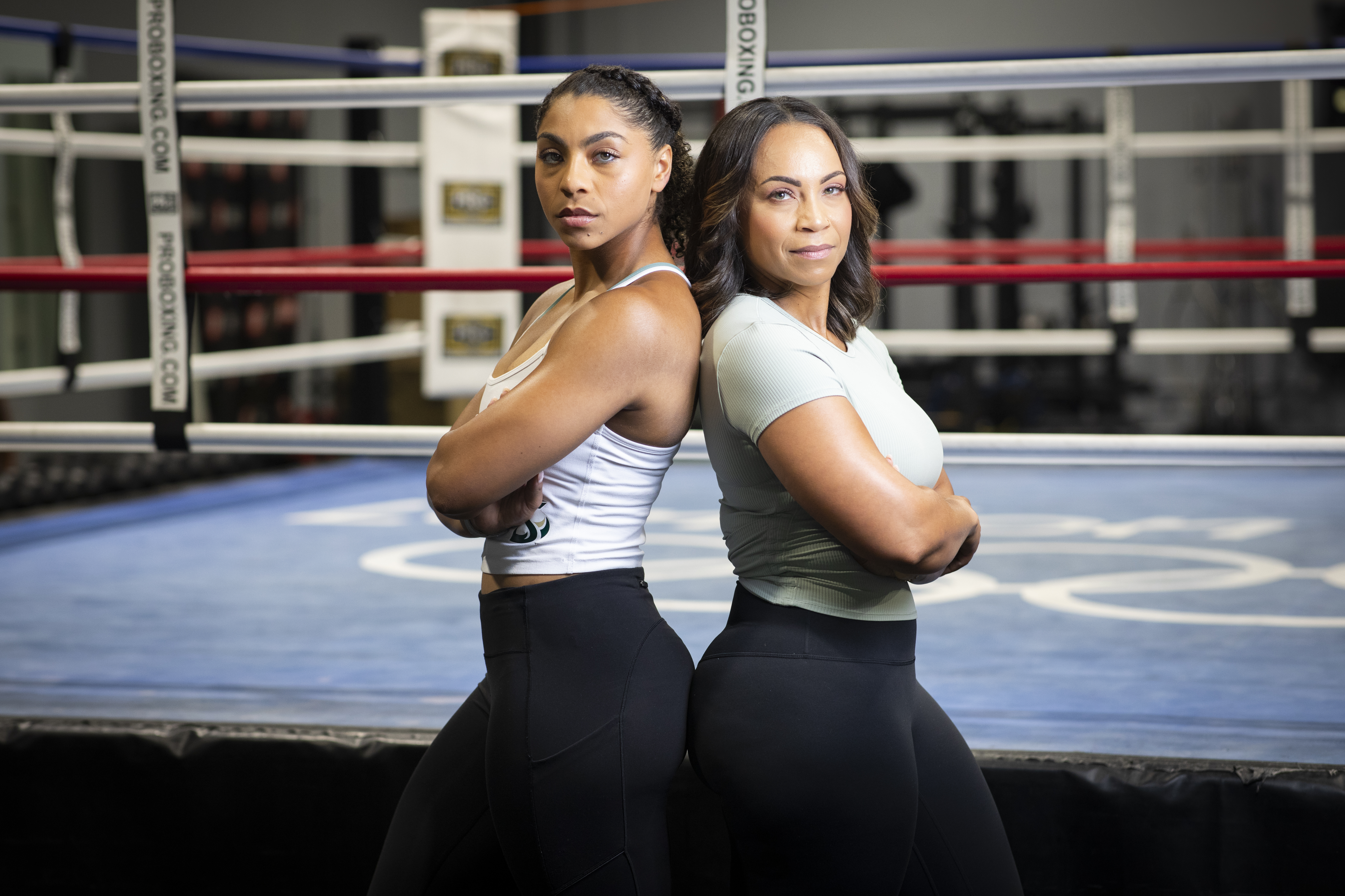 Janelle Gonzales and her daughter, Ayahna, pose in her boxing gym Flawless Boxing & Fitness.