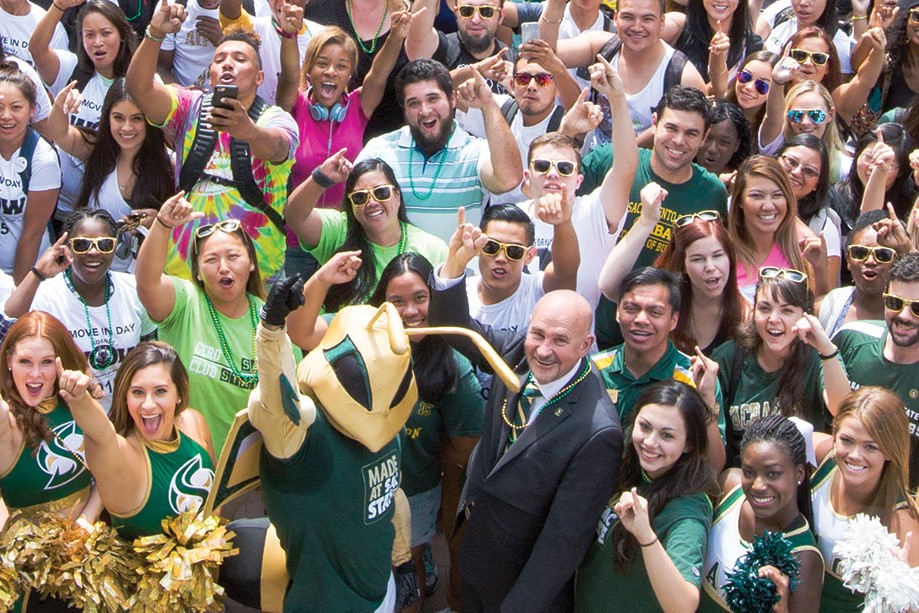 President Robert S. Nelsen and members of the campus community gather for the annual "Swarm" photograph during pre-COVID-19 days. 