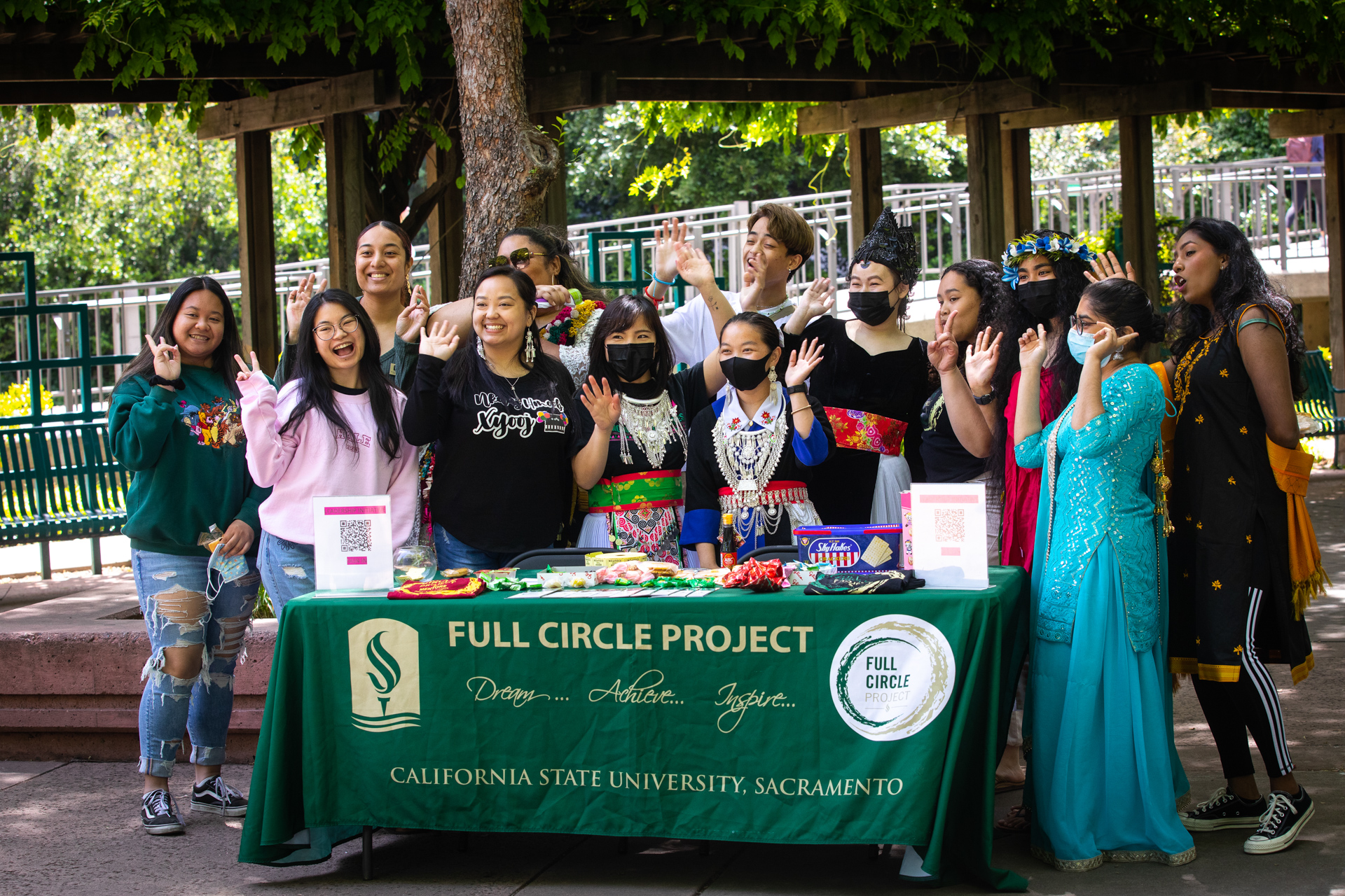 Members of the Full Circle Project at a table during an event. 