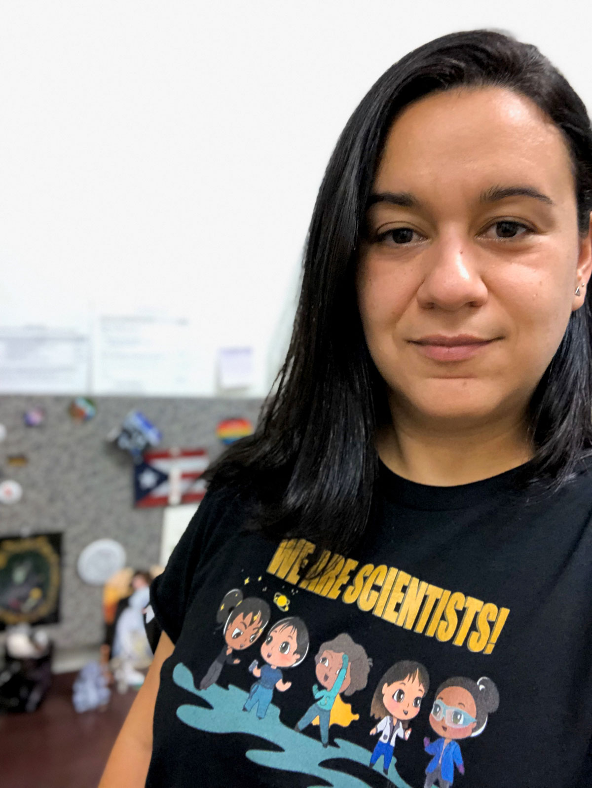 Semarhy Quinones-Soto wearing a black shirt reading "We Are Scientists"