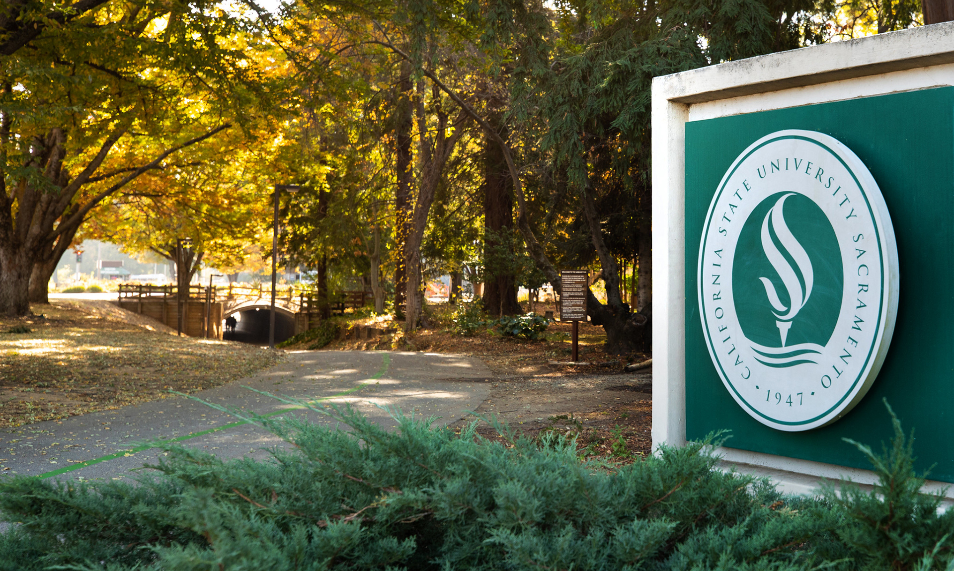 Sac State campus sign in fall. 