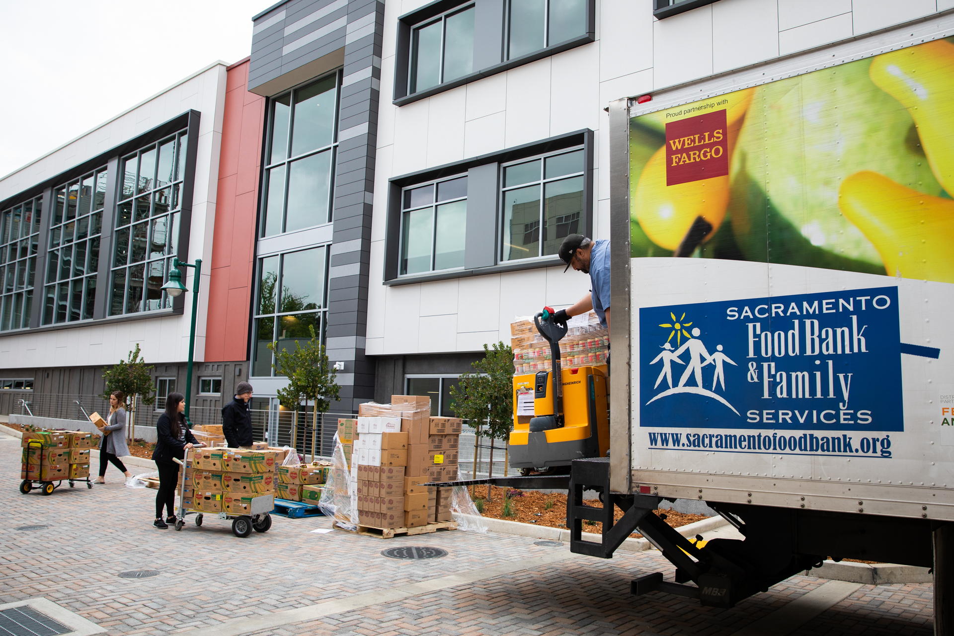 A Sacramento Food Bank truck delivers produce and nonperishable food to the Sacramento State ASI Food Pantry.