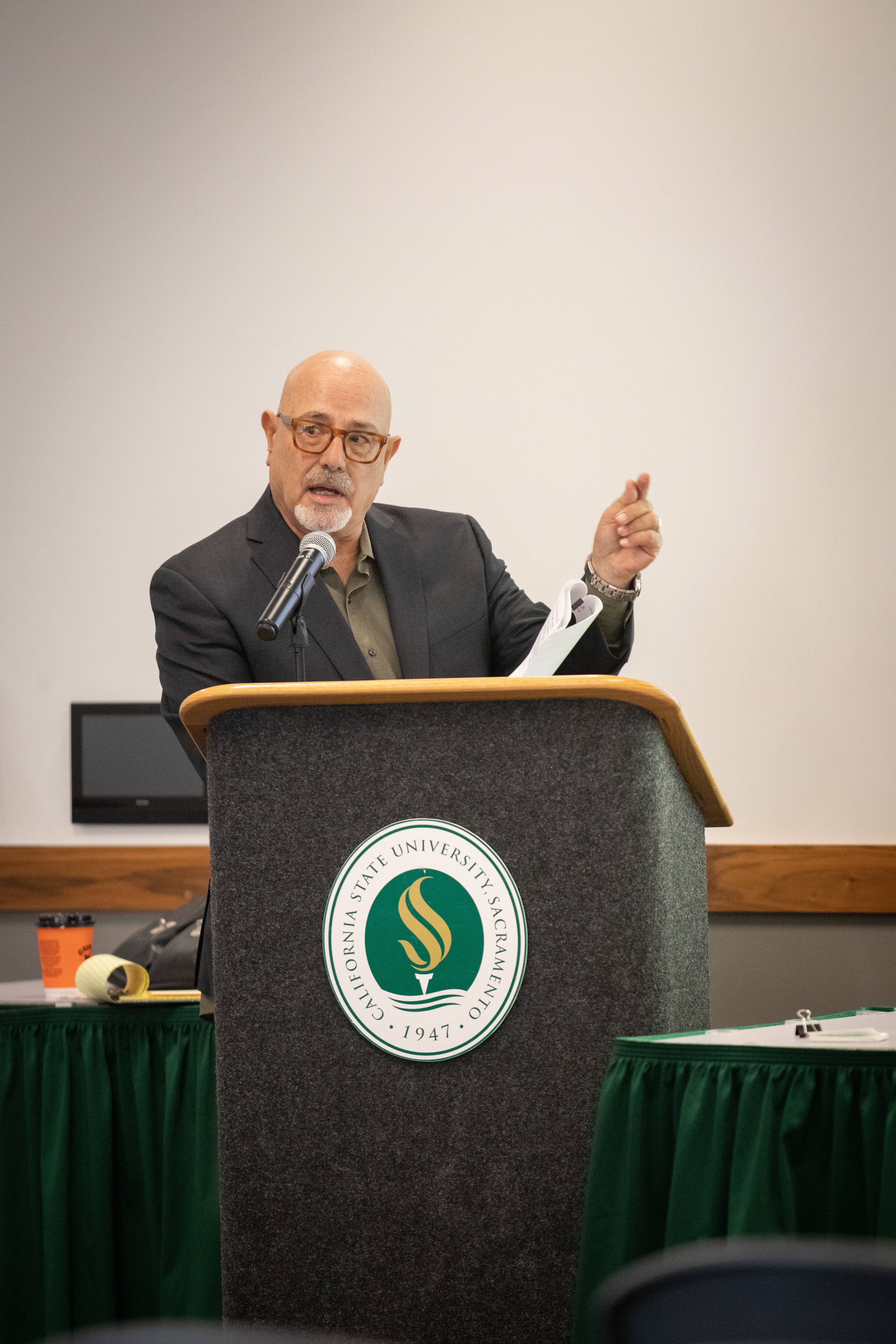 Sac State History Professor Joe Palermo on stage during a midterm election panel discussion.