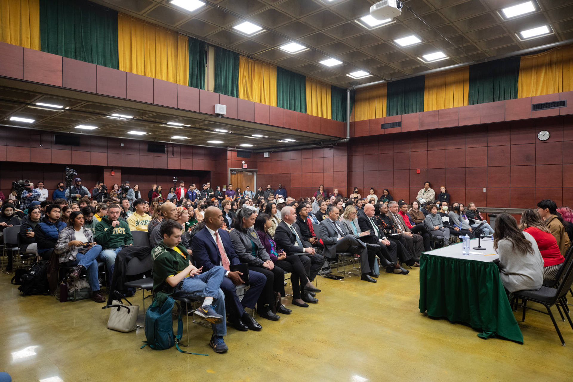 An audience, seated, in the University Union 