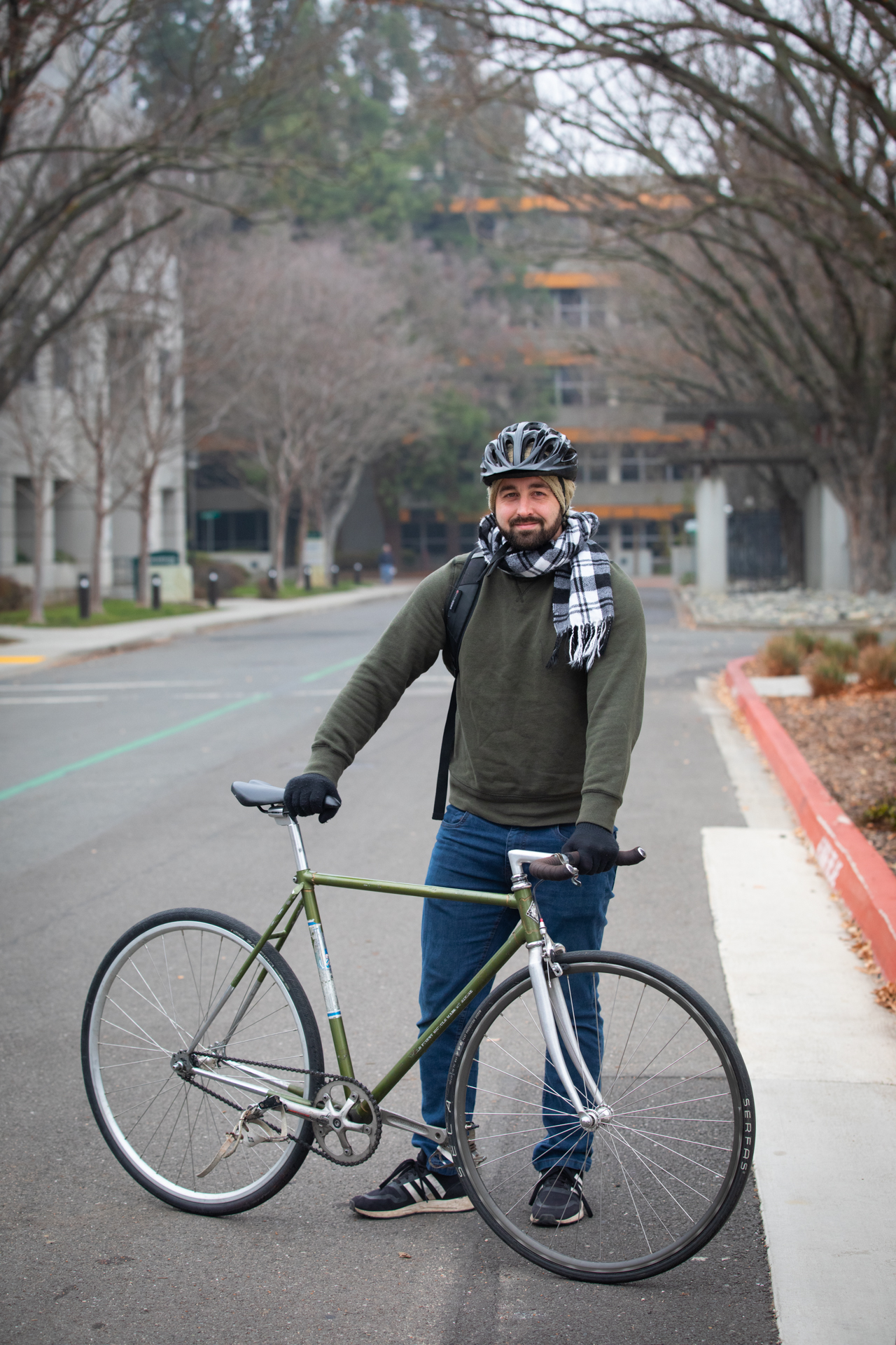 Sacramento State employee Joshua Maddox poses with his bicycle on campus. 